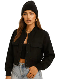 Thumbnail for Woman wearing a black jacket, black beanie, and gold jewelry on a white background