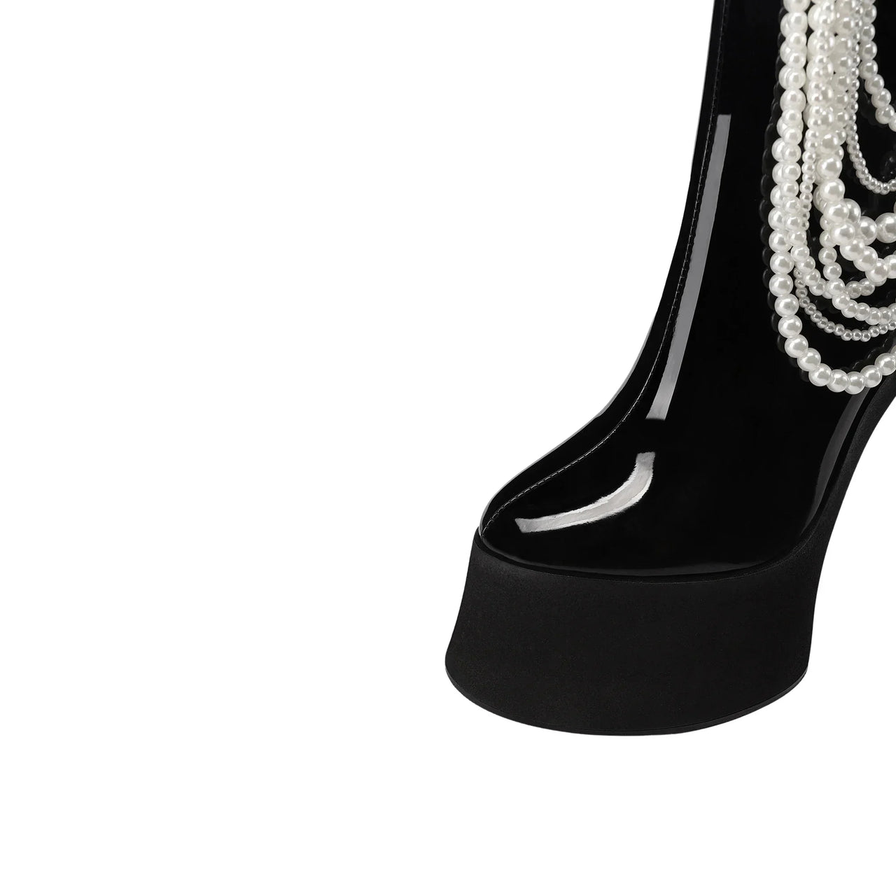 Black high-heeled shoe with pearl decorations on a white background