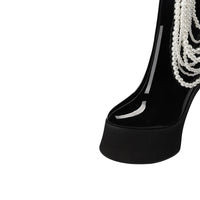 Thumbnail for Black high-heeled shoe with pearl decorations on a white background