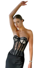 Thumbnail for Woman wearing a black lace corset on a white background