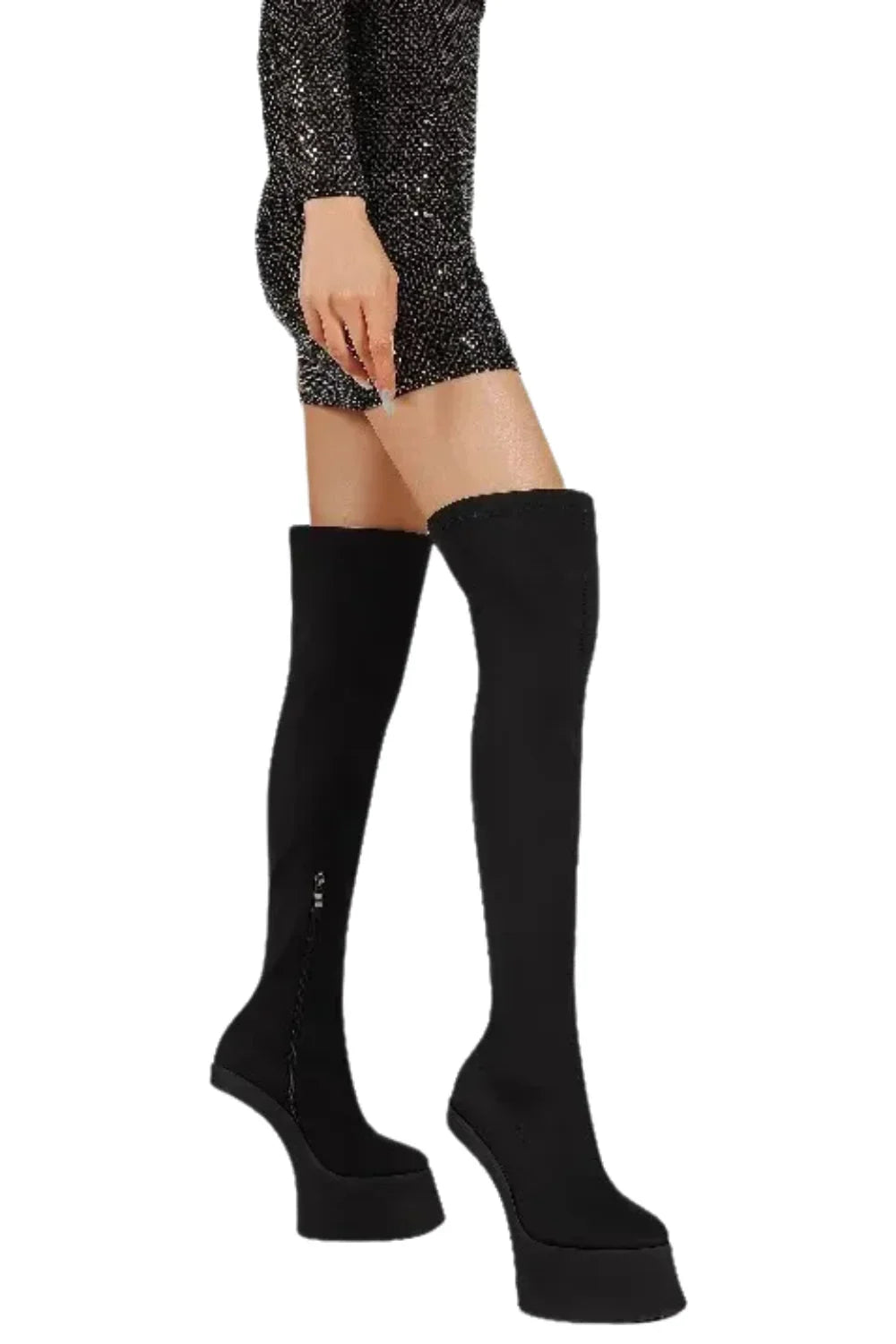 Black suede over the knee-high boots worn by a person on a white background