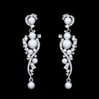 Thumbnail for A pair of bridal earrings featuring a drop design with a cluster of simulated pearls and sparkling rhinestones, with gold plating.