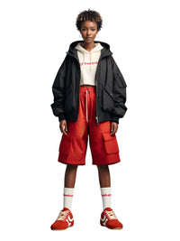 Thumbnail for Person wearing a black jacket, red shorts, and red sneakers on a white background