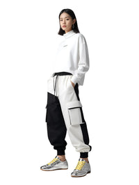 Thumbnail for Person wearing a white and black outfit with silver sneakers with yellow laces on a white background