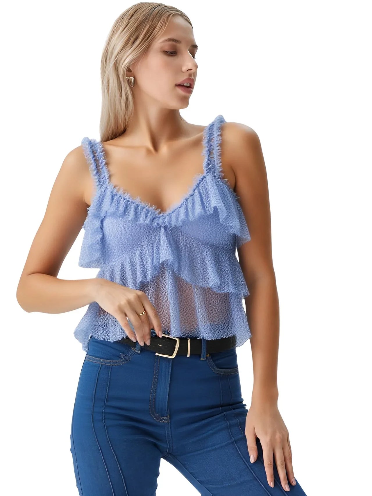 Woman wearing a light blue ruffled lace top and blue jeans on a white background