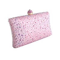 Thumbnail for Pink clutch bag with decorative embellishments on a white background