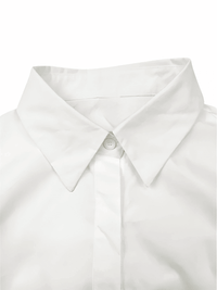 Thumbnail for Close-up of a white shirt collar with a button on a white background
