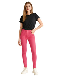 Thumbnail for Woman wearing deep pink skinny jeans and a black t-shirt on a white background