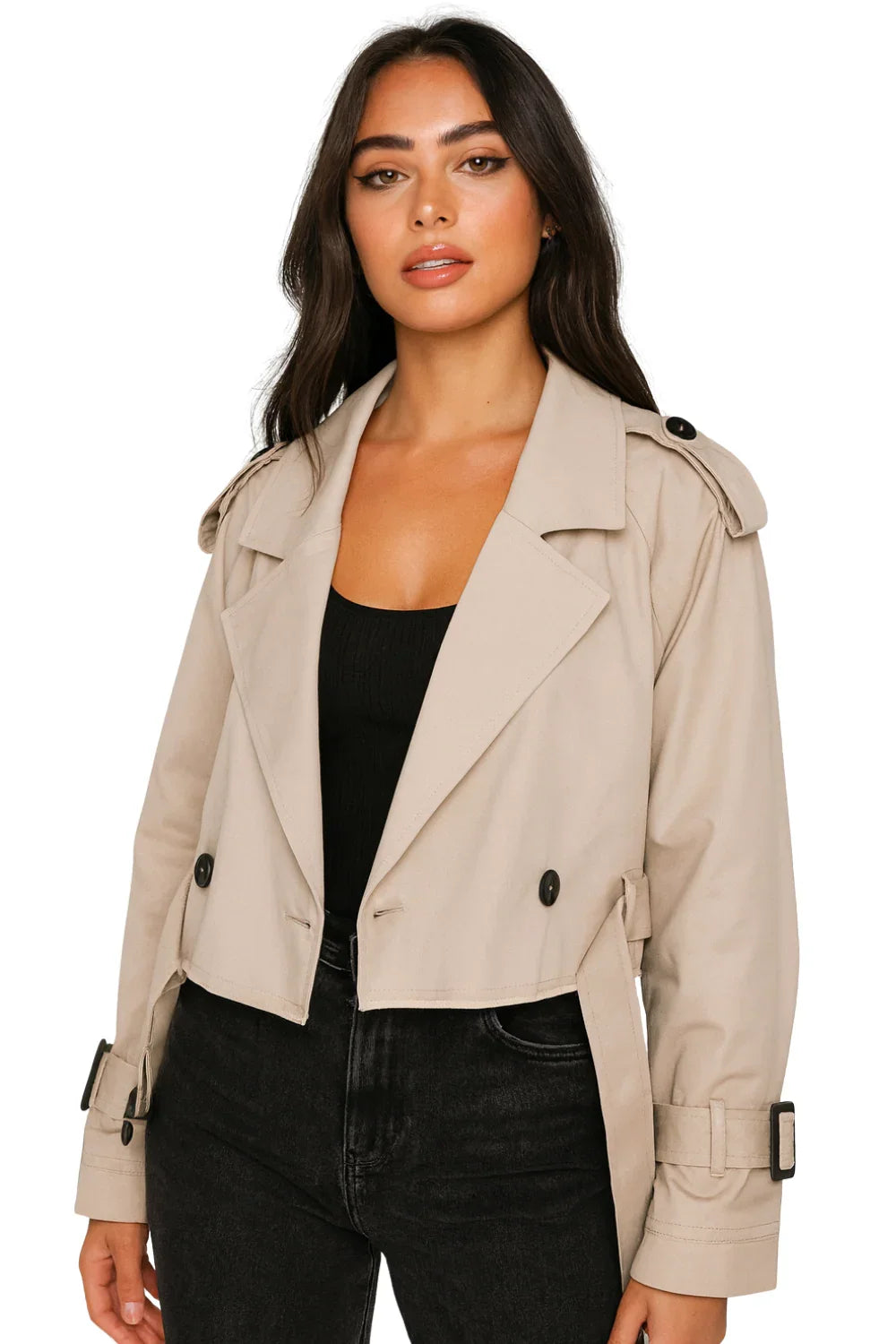 Woman wearing a khaki cropped trench coat on a white background