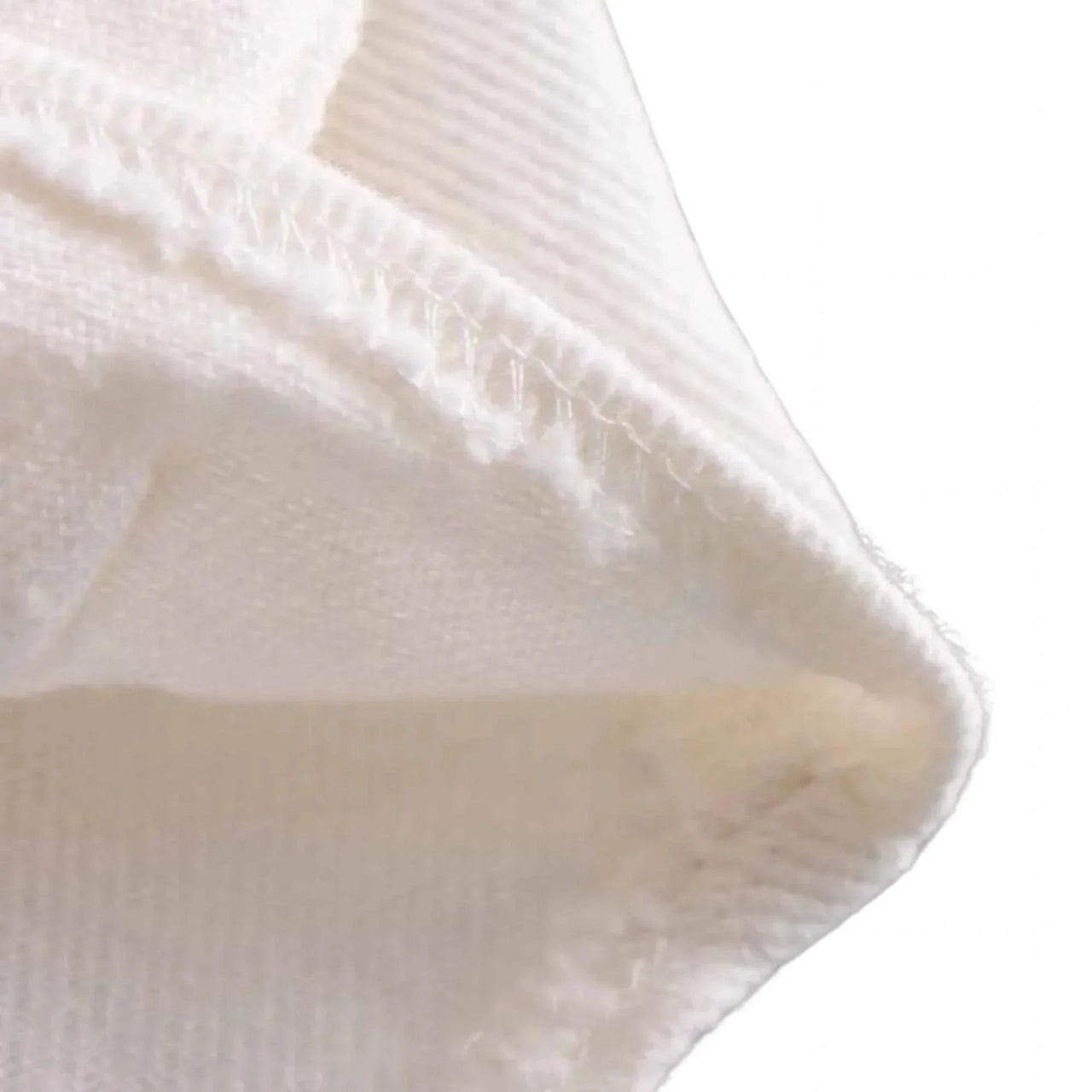Close-up of a textured white fabric corner
