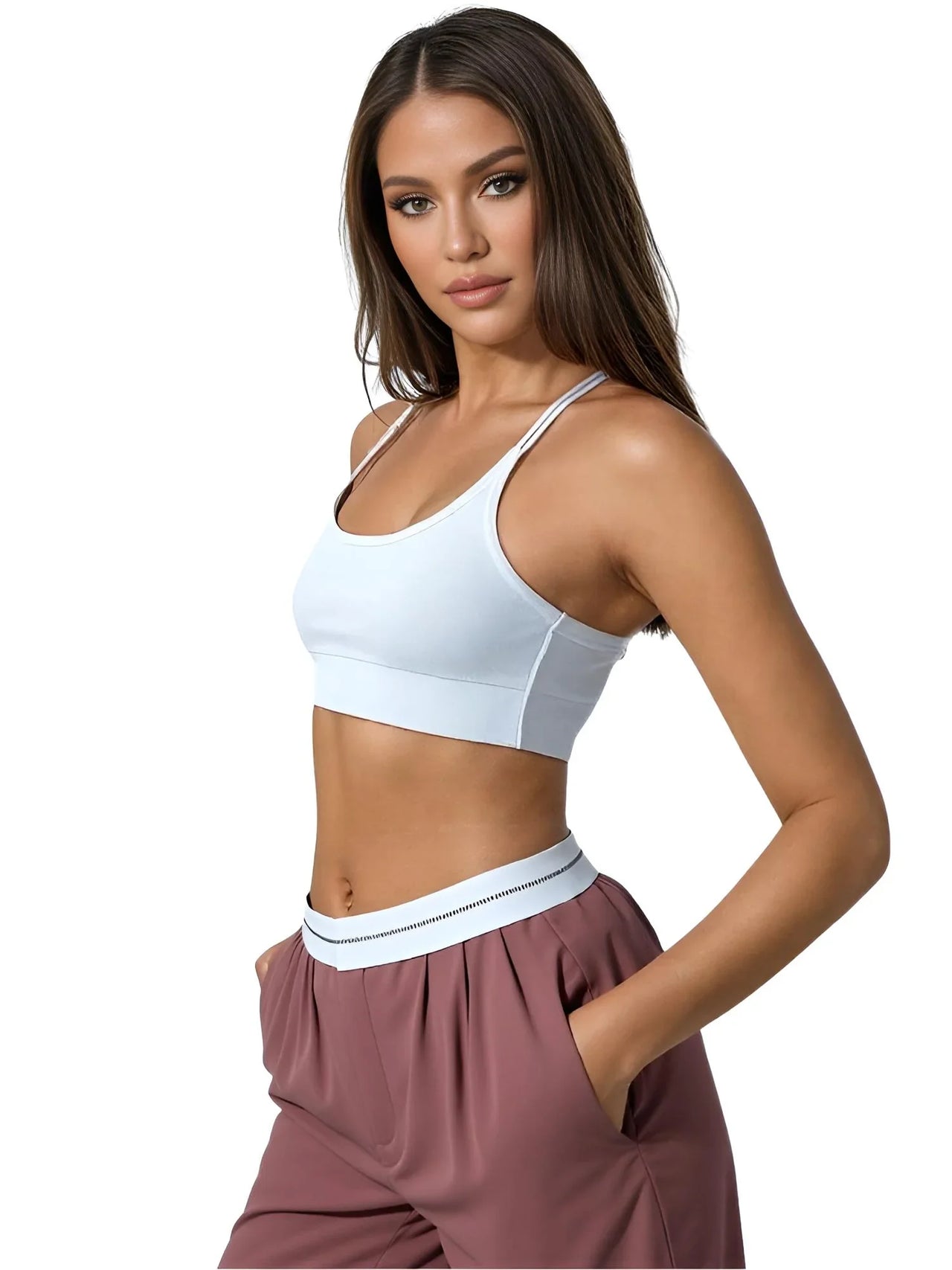 Woman wearing a white sports bra and maroon pants on a white background