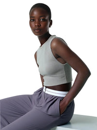 Thumbnail for Woman wearing a gray crop top and gray pants on a white background