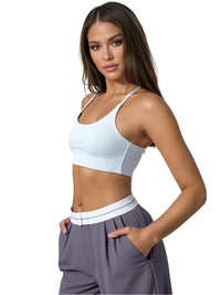 Thumbnail for Woman wearing a white sports bra and gray flip waist pants on a white background