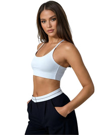 Thumbnail for Woman wearing a white sports bra and black flip waist pants on a white background