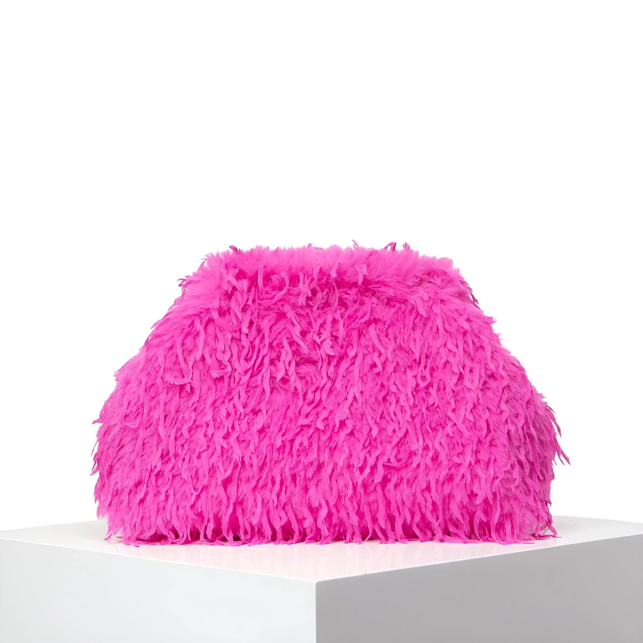 Pink fluffy pillow on a white background