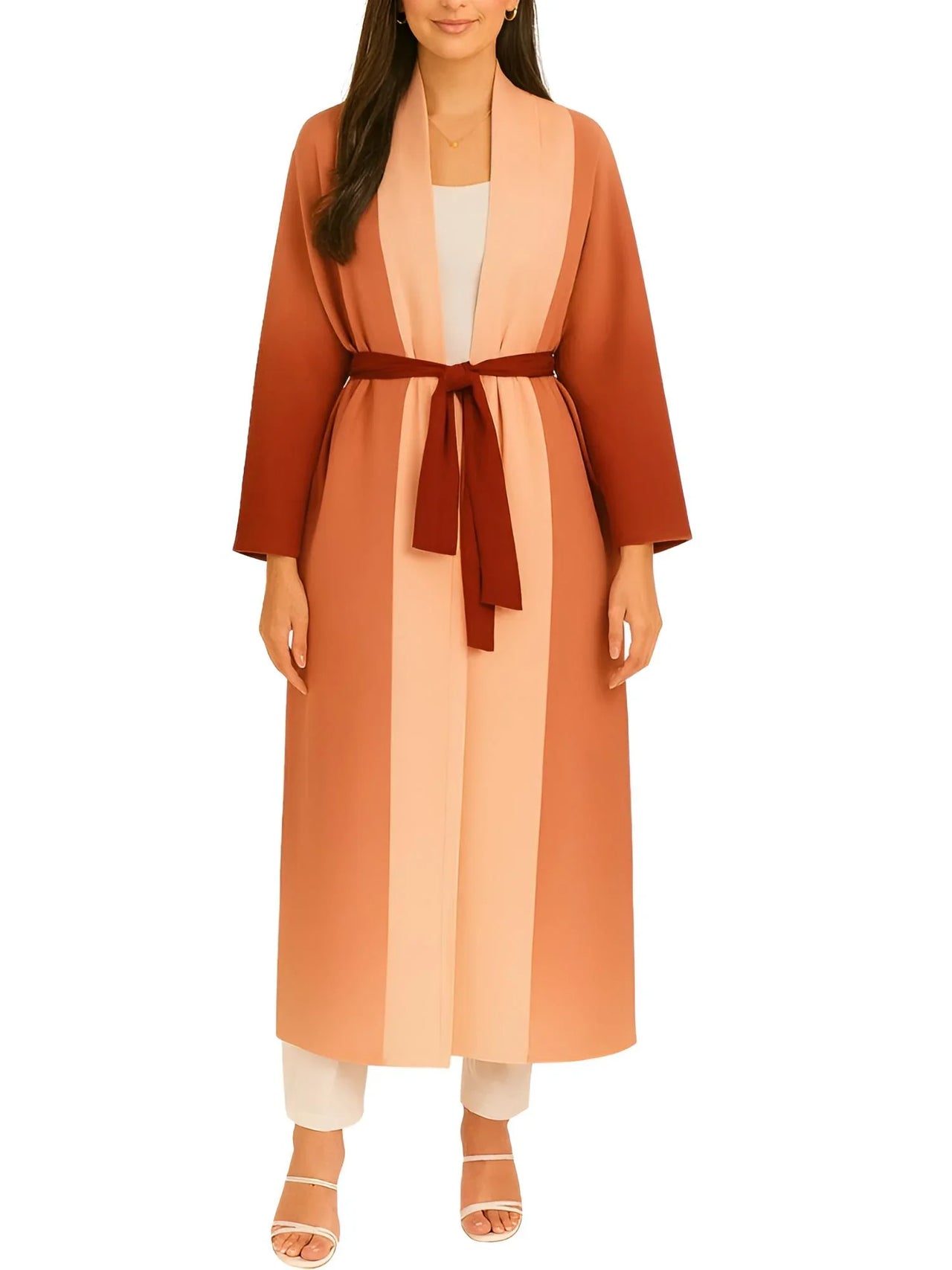 Woman wearing a long orange jacket with a dark red belt on a white background