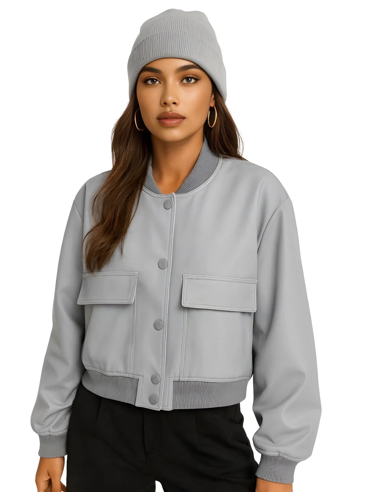 Woman wearing a gray bomber jacket and beanie on a white background