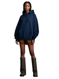 Thumbnail for Person wearing a navy blue hoodie and brown slouch boots on a white background