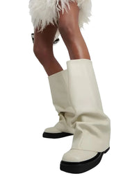 Thumbnail for White knee-high slouch boots with black soles worn by a person on a white background