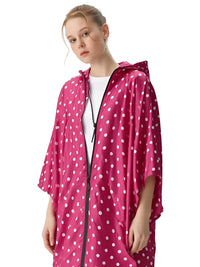 Thumbnail for Person wearing a pink polka dot raincoat on a white background