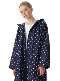 Thumbnail for Person wearing a navy raincoat with white polka dots on a white background