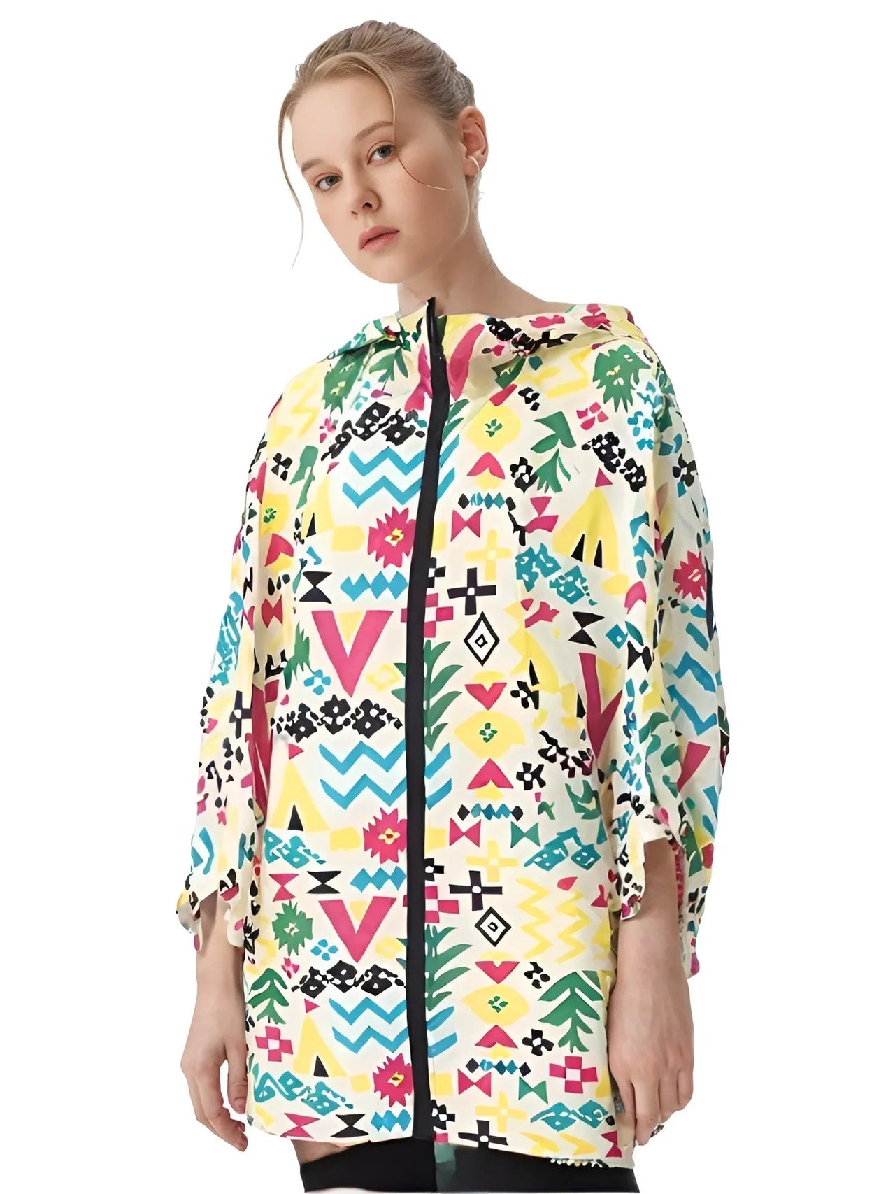 Person wearing a colorful patterned hooded raincoat on a white background