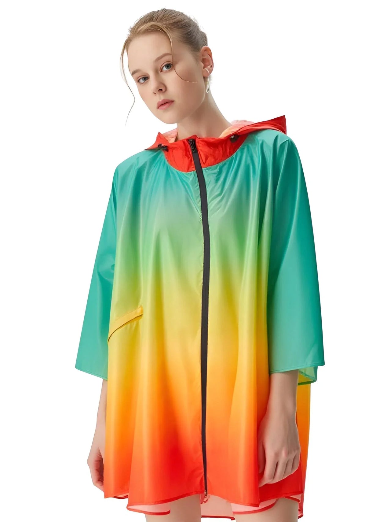 Woman wearing a colorful gradient raincoat with a white background