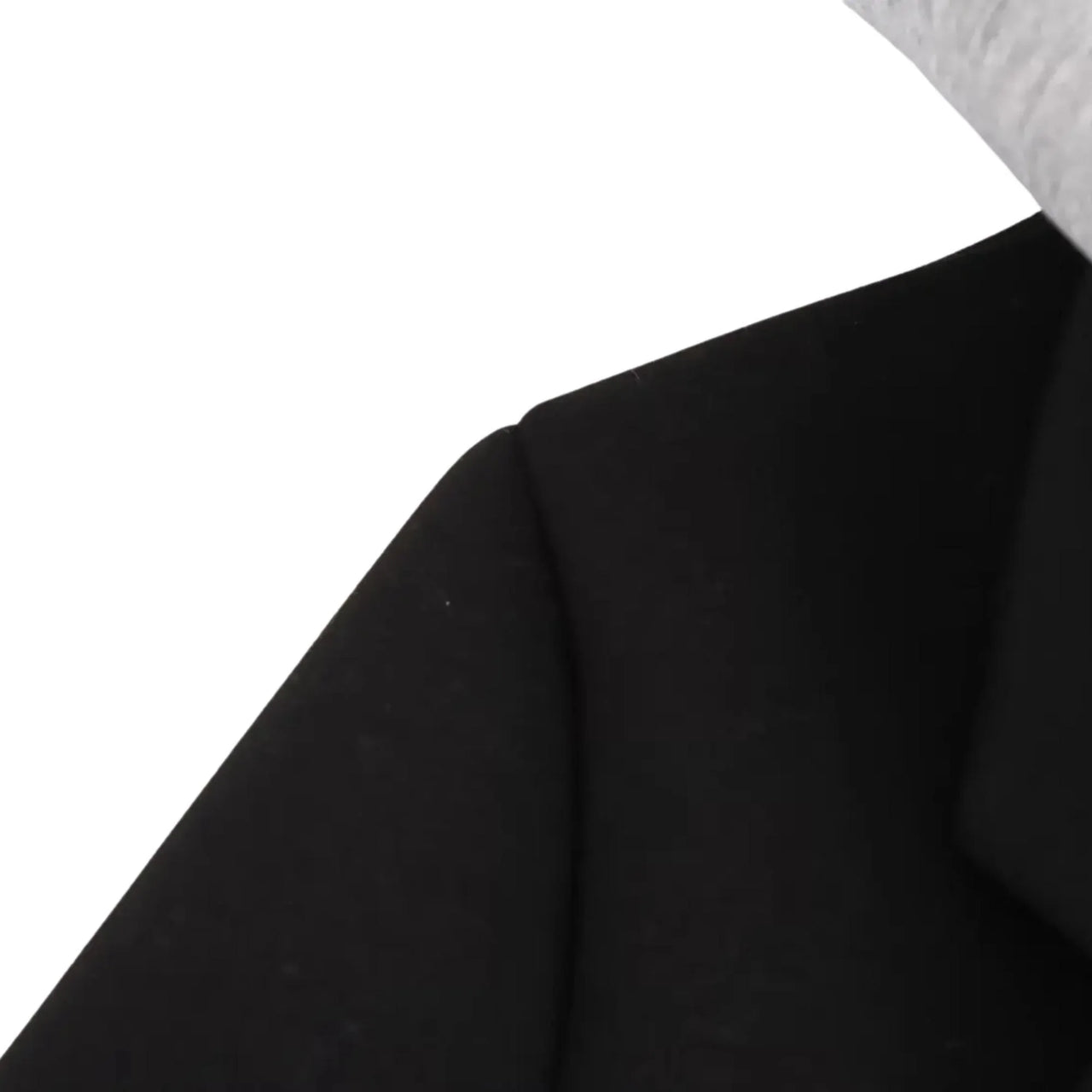 Close-up of a black fabric texture on a white background