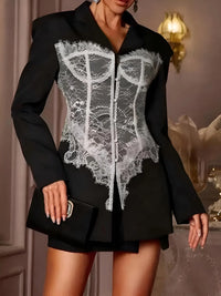 Thumbnail for Black blazer with white lace detailing worn by a person, with a blurred background.