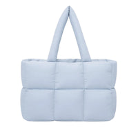 Thumbnail for Light blue puffer bag on a white background