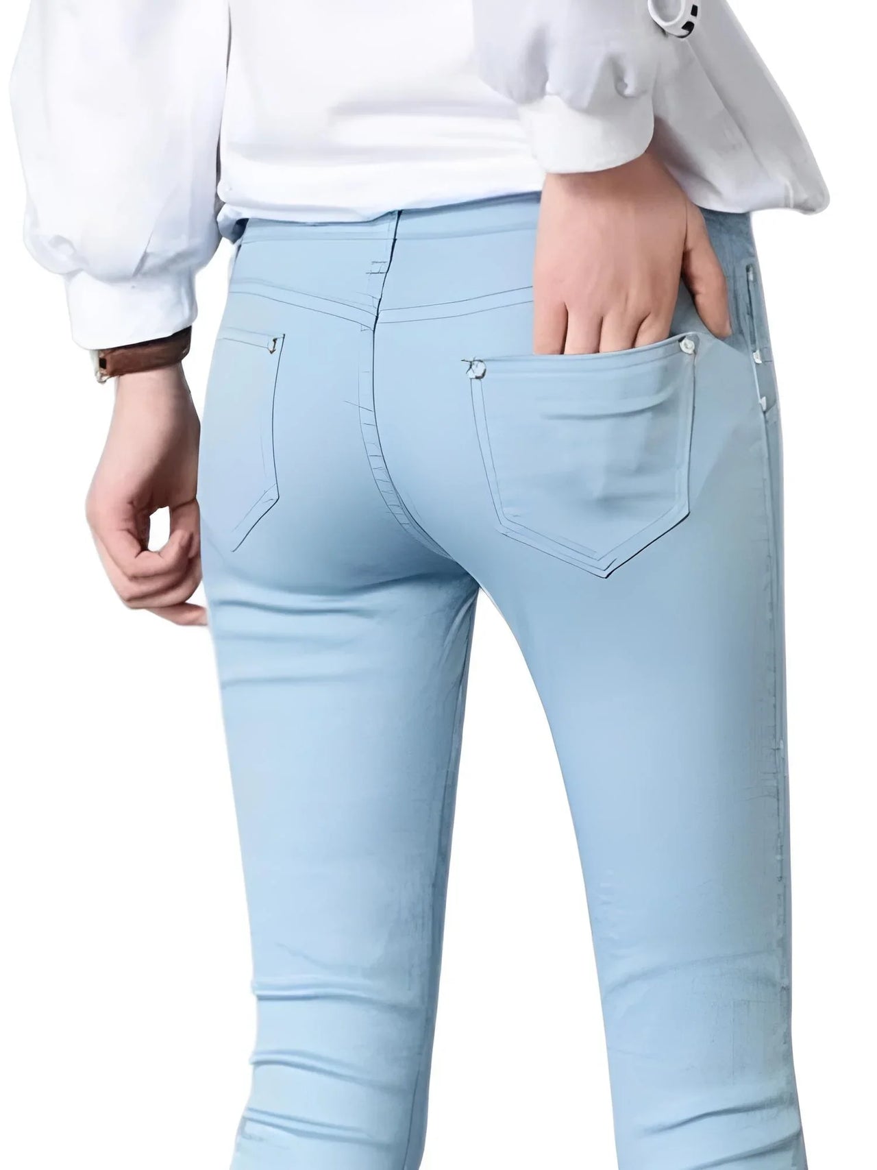 Light blue skinny jeans worn by a person on a white background