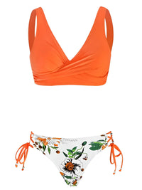 Thumbnail for Orange bikini top and floral-patterned bottom on a white background