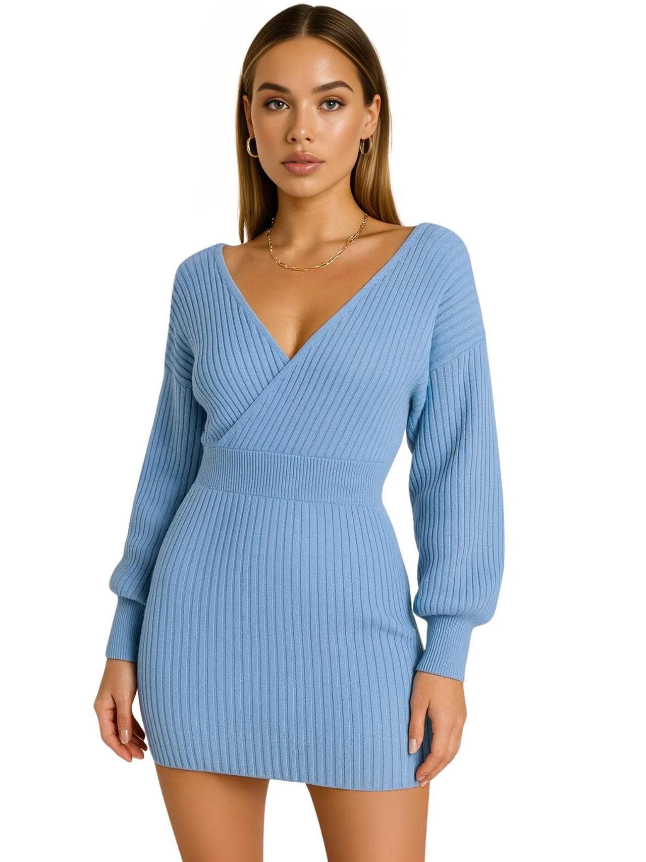 Woman wearing a light blue sweater dress on a white background