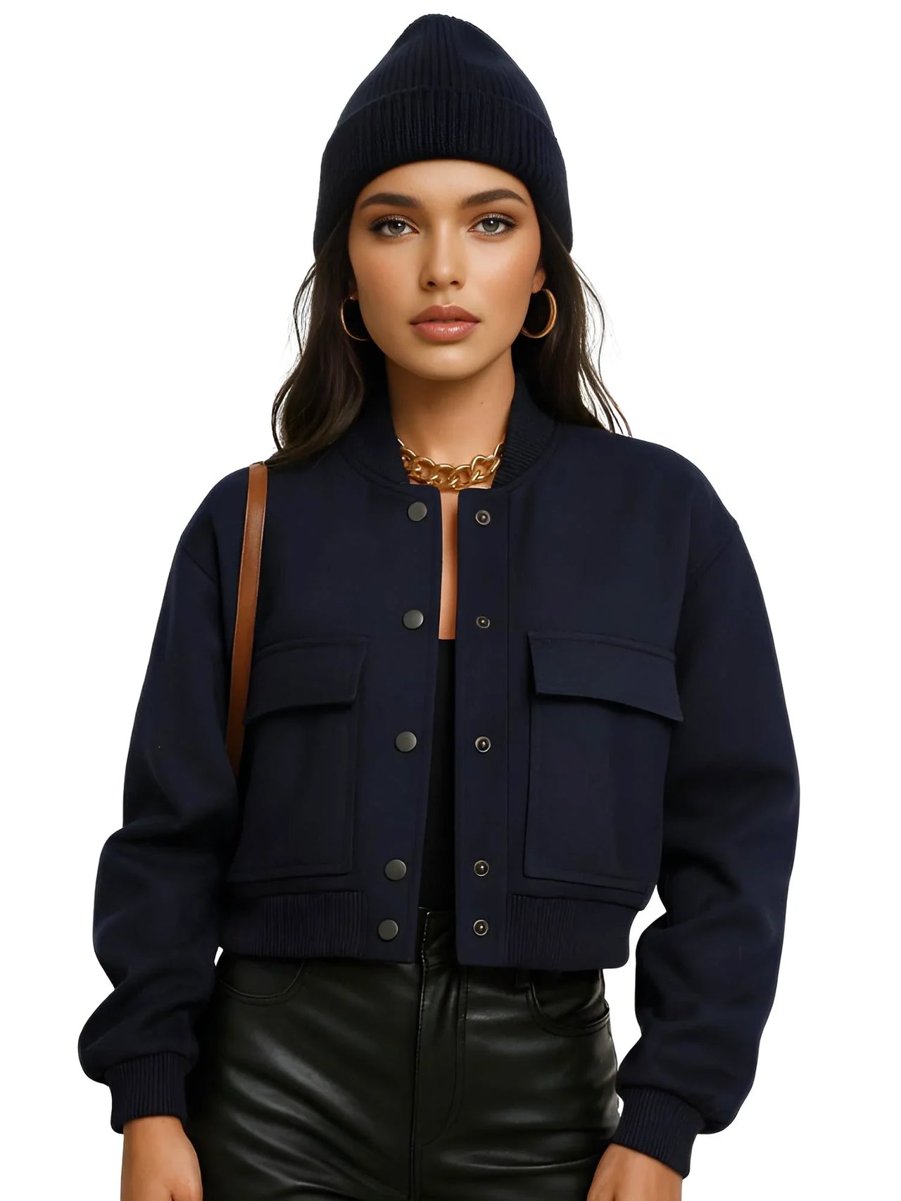 Woman wearing a navy blue jacket and beanie on a white background