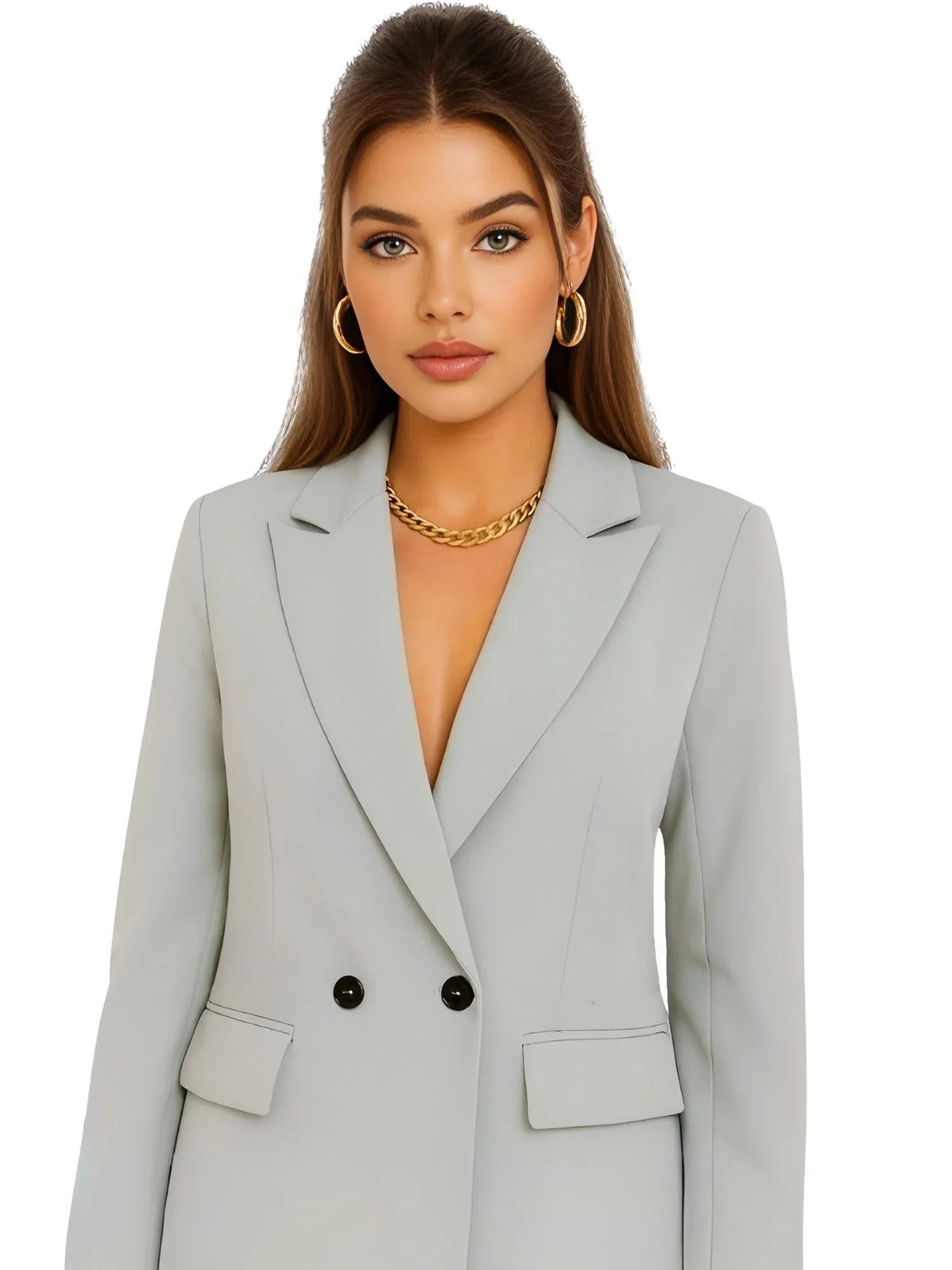 Woman wearing a pale green blazer with a plain background