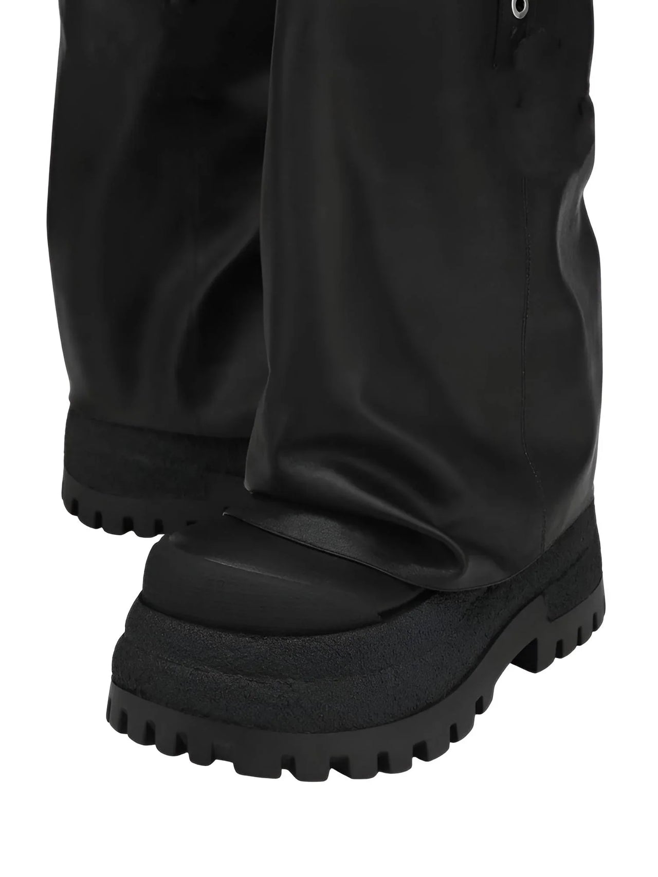 Black leather platform slouch boots with thick sole on a white background