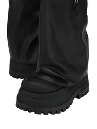 Thumbnail for Black leather platform slouch boots with thick sole on a white background