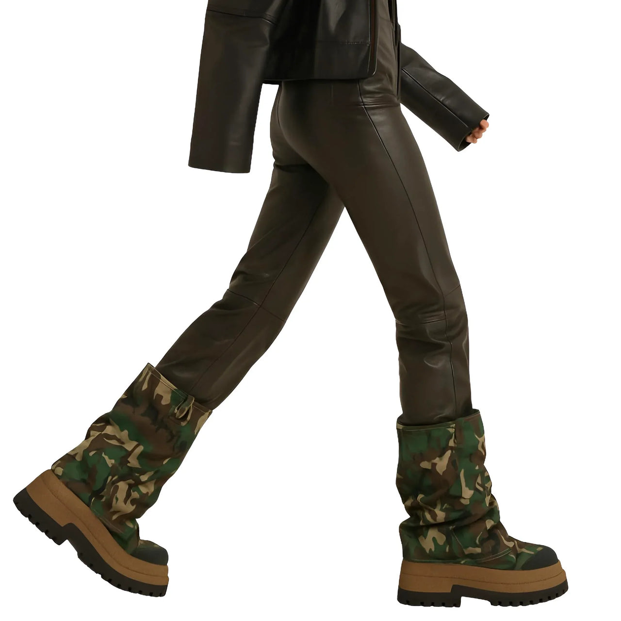 Camouflage platform slouch boots worn with leather pants and jacket on a white background