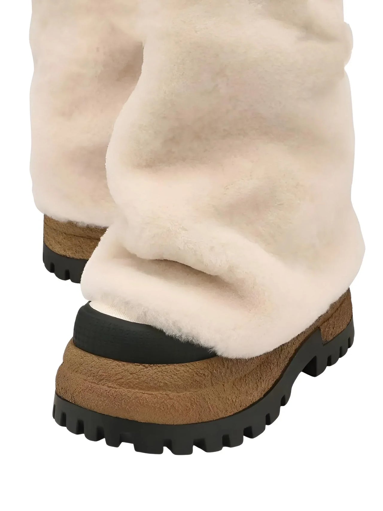 Pair of milk white platform slouch boots with black soles on a white background