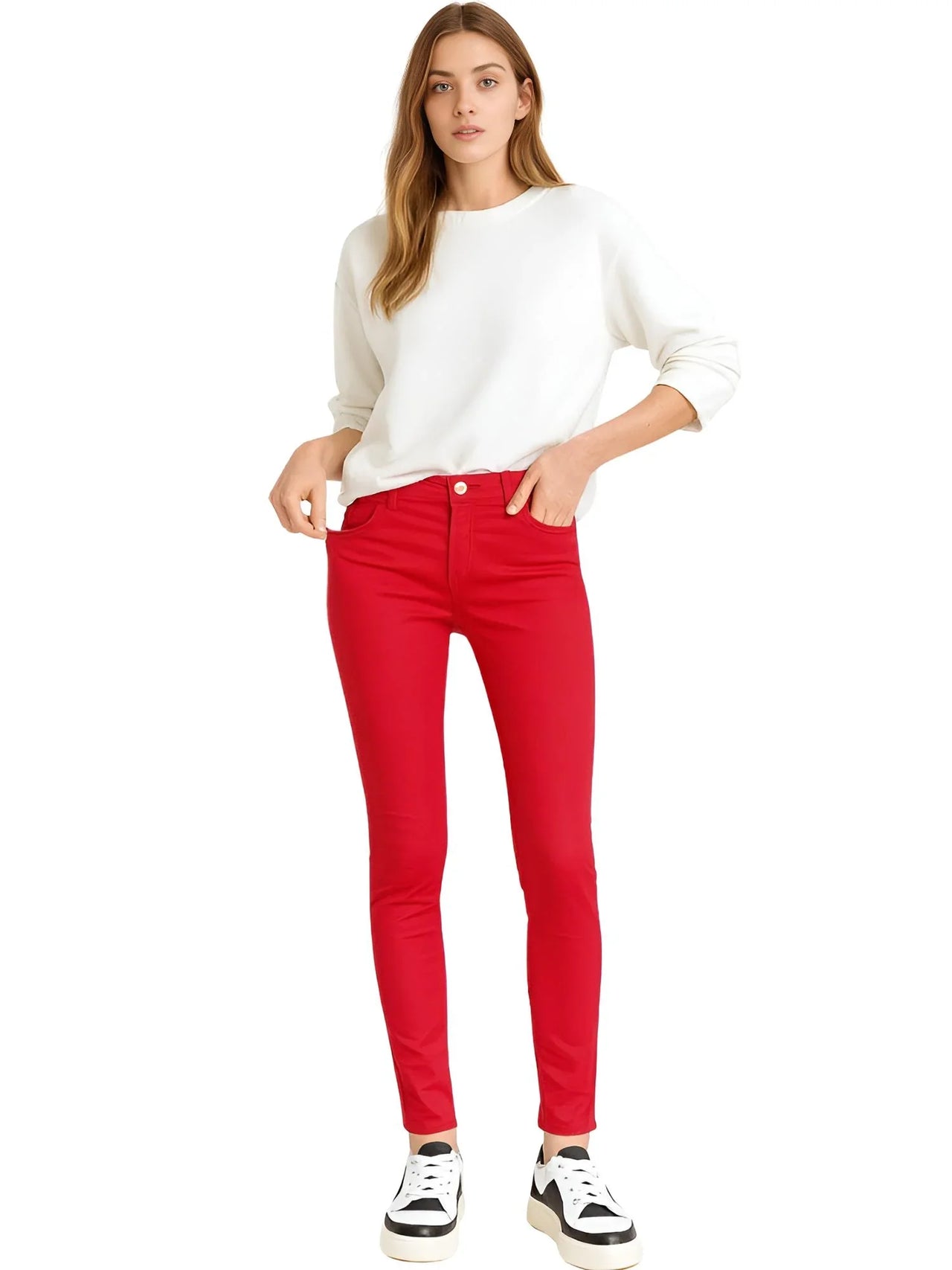 Woman wearing a white sweater and red skinny jeans on a white background, Red skinny jeans women