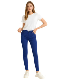 Thumbnail for Woman wearing royal blue skinny jeans and a white t-shirt on a white background