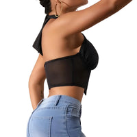 Thumbnail for Person wearing a black halter top and blue jeans on a white background