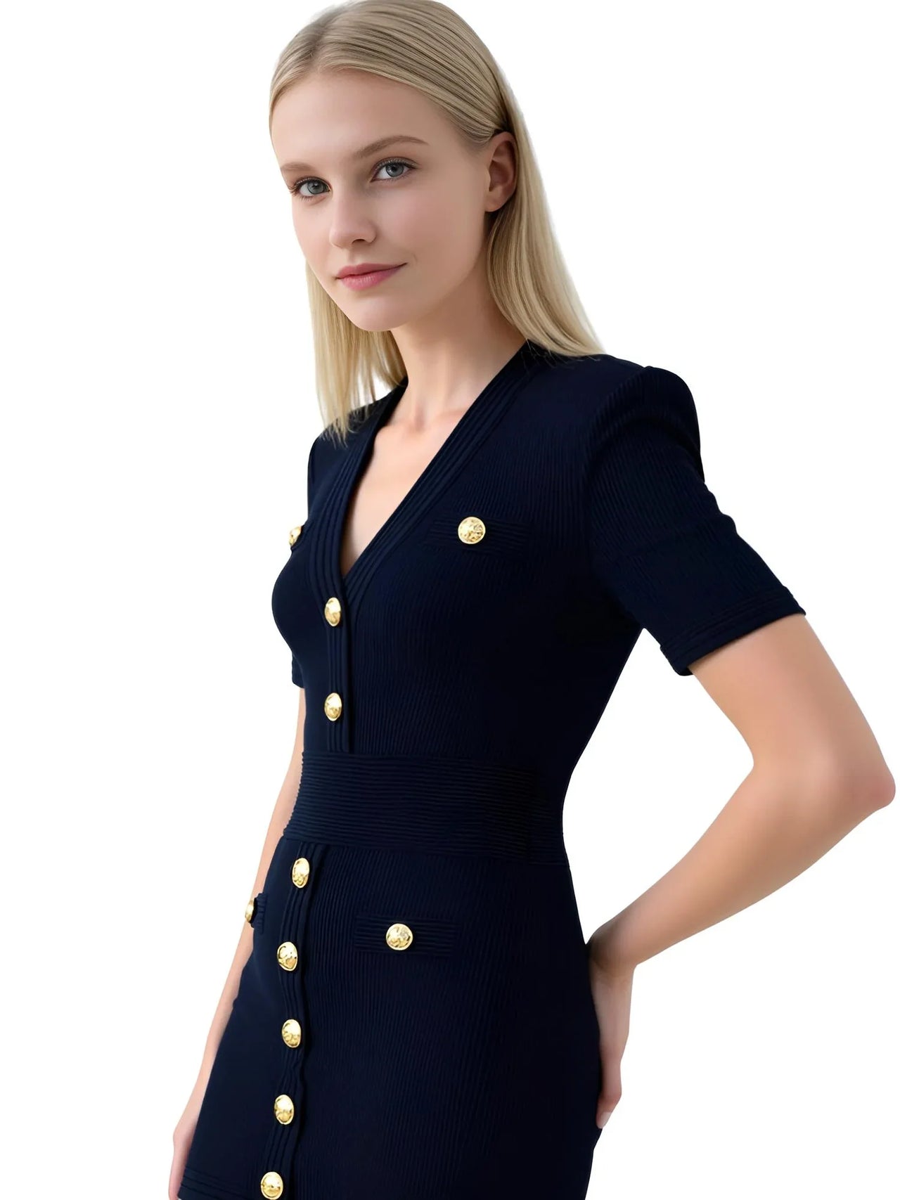 Woman wearing a black short sleeve dress with gold buttons on a white background