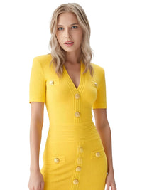 Thumbnail for Woman wearing a yellow dress with buttons on a white background