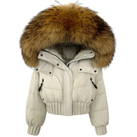 Thumbnail for Beige puffer jacket with a large fur hood on a white background