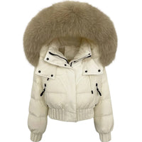 Thumbnail for Beige puffer jacket with a large fur hood on a white background
