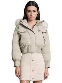 Thumbnail for Woman wearing a beige puffer jacket with fur hood on a white background