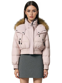 Thumbnail for Woman wearing a pink winter jacket with a large fur hood on a white background