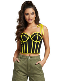 Thumbnail for Woman wearing a black and yellow crop top with green pants on a white background