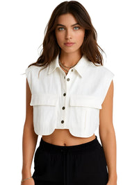 Thumbnail for Woman wearing a white sleeveless top with black buttons on a white background